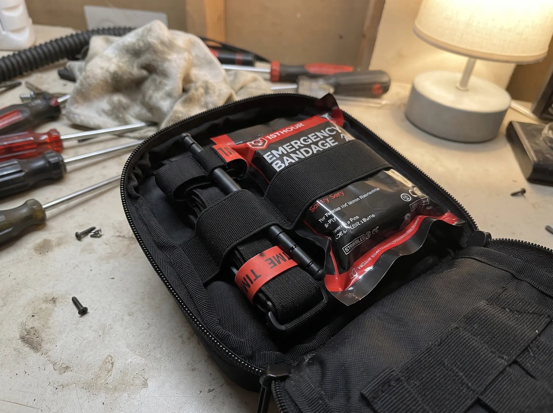 Tourniquet and Israeli pressure bandage secured in their loops